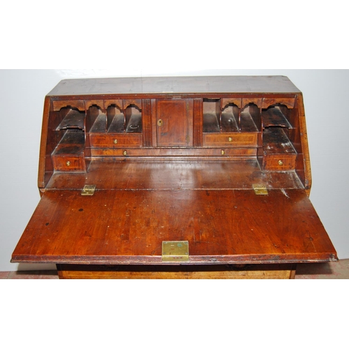 373 - Mid-18th century walnut bureau, the fall front enclosing drawers and pigeon holes, above four gradua... 