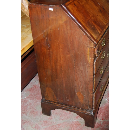 373 - Mid-18th century walnut bureau, the fall front enclosing drawers and pigeon holes, above four gradua... 