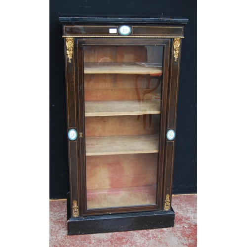 374 - Victorian style ebonised pier cabinet, the glazed door enclosing shelves, decorated with Sèvres-styl... 