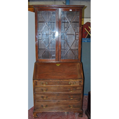 375 - Composite mahogany bureau bookcase, the Edwardian bookcase top with dentil decoration above two astr... 