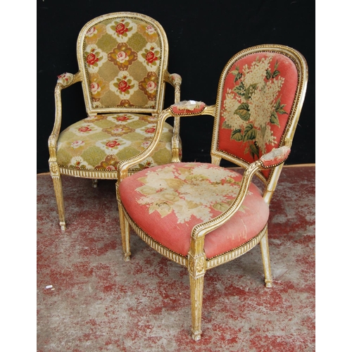 377 - Pair of near-matching Louis XV style giltwood and painted fauteuils, upholstered in non-matching flo... 