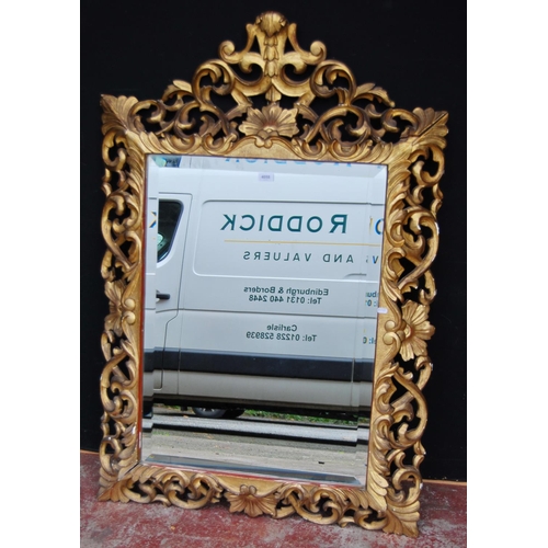 378 - Rococo-style giltwood and gesso overmantel mirror decorated with all over pierced scrolls and swags,... 