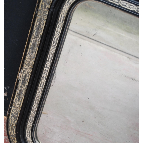 380 - Victorian ebonised overmantel mirror decorated with white metal foliate banding, 75cm high and 114cm... 