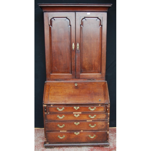 383 - Georgian mahogany bureau cabinet, the cabinet top with two panelled doors enclosing shelves, above a... 