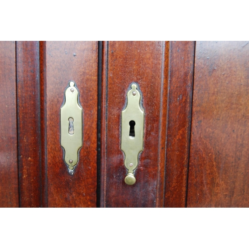 383 - Georgian mahogany bureau cabinet, the cabinet top with two panelled doors enclosing shelves, above a... 