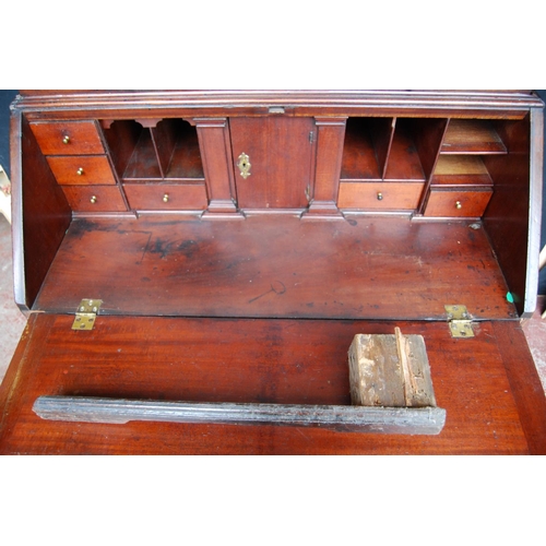 383 - Georgian mahogany bureau cabinet, the cabinet top with two panelled doors enclosing shelves, above a... 