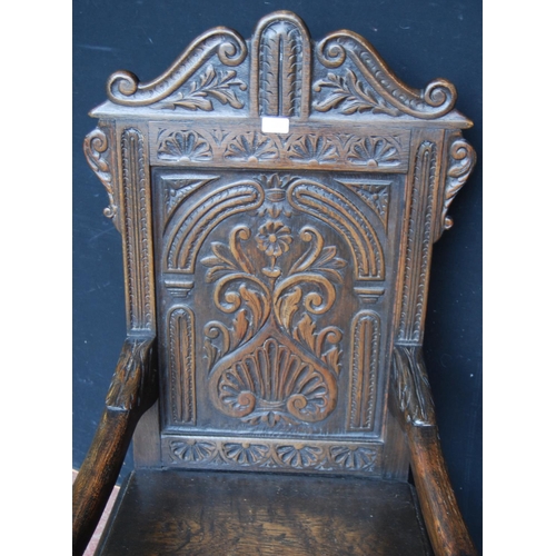 384 - 18th century-style Wainscot oak armchair, the scroll top above floral panels, acanthus moulded armre... 