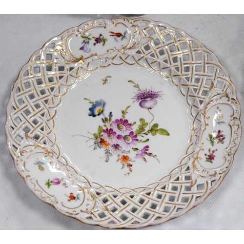 231 - Set of four continental porcelain fruit plates decorated with colourful floral sprays and pierced la... 