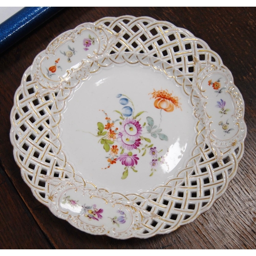 231 - Set of four continental porcelain fruit plates decorated with colourful floral sprays and pierced la... 