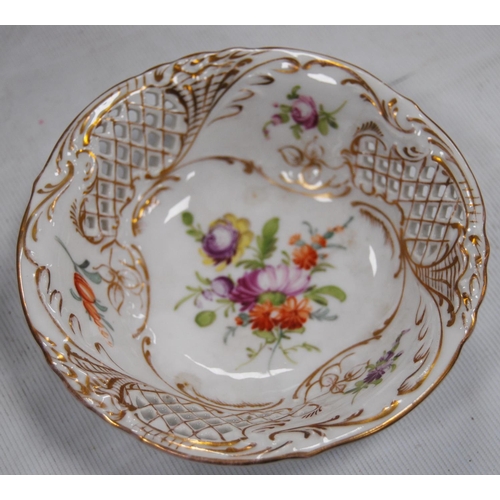 231 - Set of four continental porcelain fruit plates decorated with colourful floral sprays and pierced la... 