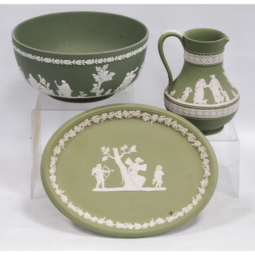 233 - Three pieces of Wedgwood green Jasper ware comprising a bowl, jug and oval dish, all decorated with ... 