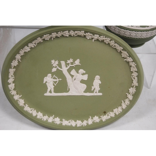 233 - Three pieces of Wedgwood green Jasper ware comprising a bowl, jug and oval dish, all decorated with ... 