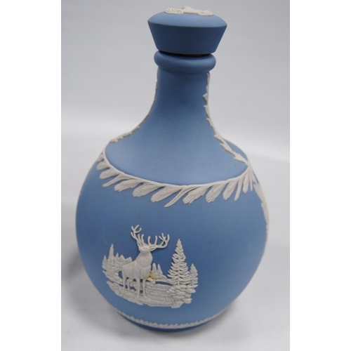 234 - Six pieces of Wedgwood blue Jasper ware comprising two jugs, two spill vases and a small planter, al... 