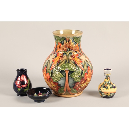 22 - Modern Moorcroft Flame of the Forest vase; 25cm high; together with three other pieces of modern Moo... 