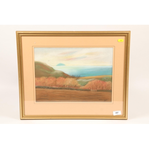 387 - Ralston Gudgeon (1910 - 1984; British); Fields Looking over Arran; pastel on paper; signed and frame... 