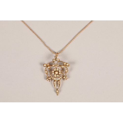 85 - Edwardian 9 carat yellow gold and seed pearl pendant and chain; gross weight 5.8g