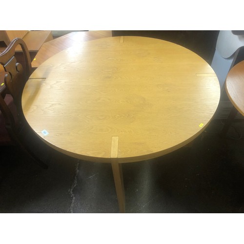 638 - Oak circular table raised on heavy rectangular legs