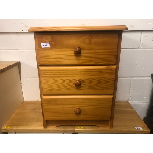 632 - Pine bedside chest of three long drawers