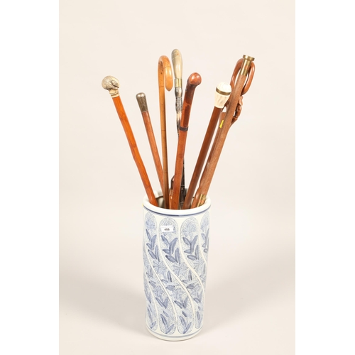 488 - Assorted sticks and canes; together a Chinese blue and white porcelain stick stand