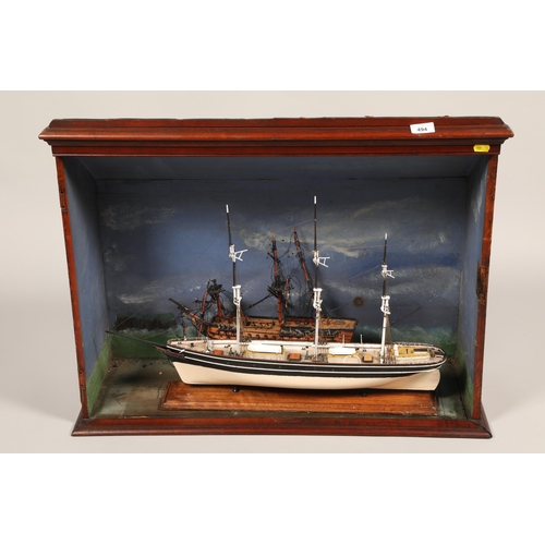 494 - Cased ship on stand together with one other