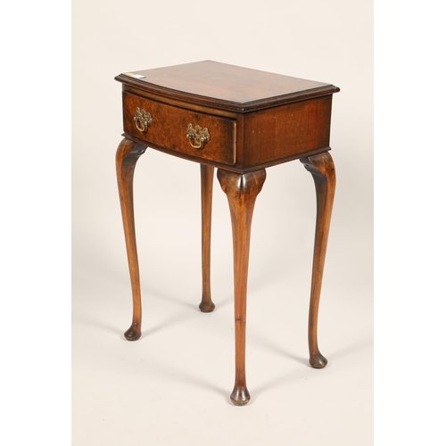 519 - Walnut veneered single drawer side table; raised on cabriole legs