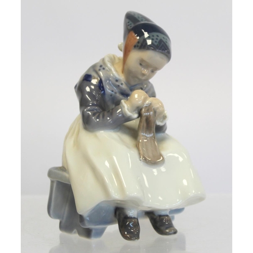 202 - Royal Copenhagen porcelain figure of a seated girl darning a sock, no. 1314, 1923 green underglaze m... 