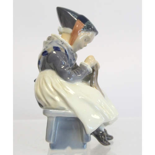 202 - Royal Copenhagen porcelain figure of a seated girl darning a sock, no. 1314, 1923 green underglaze m... 