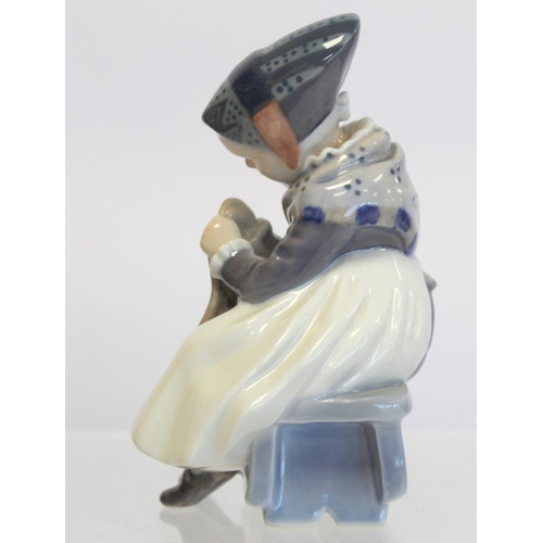 202 - Royal Copenhagen porcelain figure of a seated girl darning a sock, no. 1314, 1923 green underglaze m... 