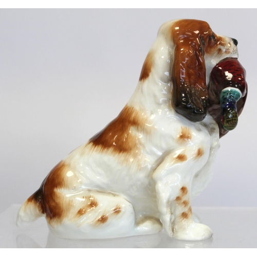 203 - Royal Doulton bone china figure of a seated spaniel holding a pheasant, HN1001, 17cm high.