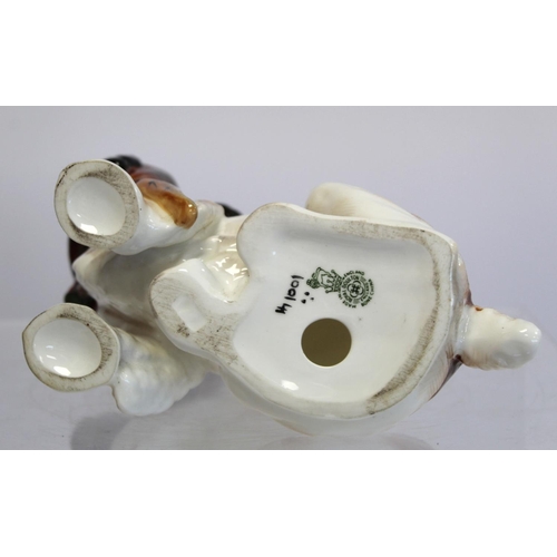 203 - Royal Doulton bone china figure of a seated spaniel holding a pheasant, HN1001, 17cm high.