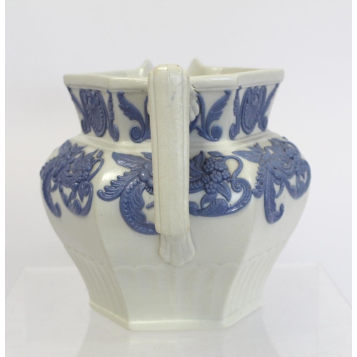 207 - Early Victorian moulded jug of hexagonal baluster form, the white stoneware body with applied blue, ... 