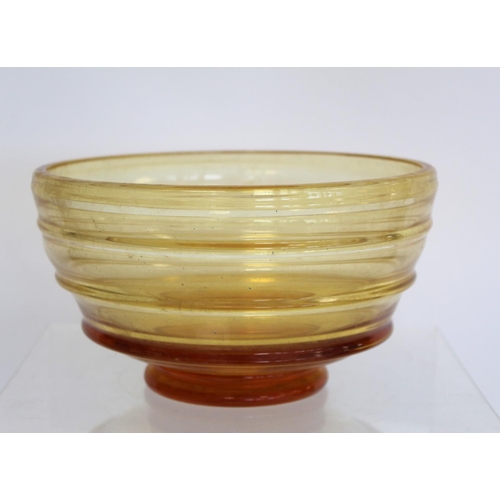 209 - Barnaby Powell for Whitefriars ribbon trailed amber glass footed bowl with polished base, 21cm diam.