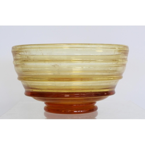 209 - Barnaby Powell for Whitefriars ribbon trailed amber glass footed bowl with polished base, 21cm diam.