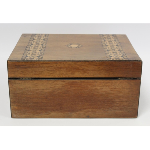 218 - Victorian walnut workbox with inlaid marquetry banding, panel and escutcheon, the interior with lift... 