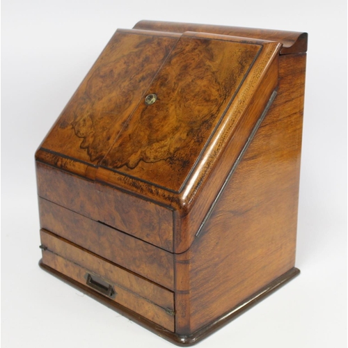 219 - Victorian burr walnut writing box of sloping rectangular form with twin hinged doors, pull out writi... 