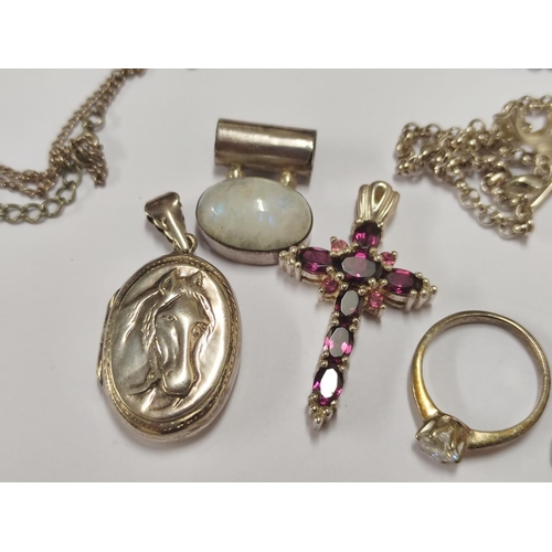 106 - Group of 925 silver to include pendant with a horse profile, moonstone-style pendant, amethyst-colou... 