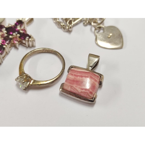106 - Group of 925 silver to include pendant with a horse profile, moonstone-style pendant, amethyst-colou... 