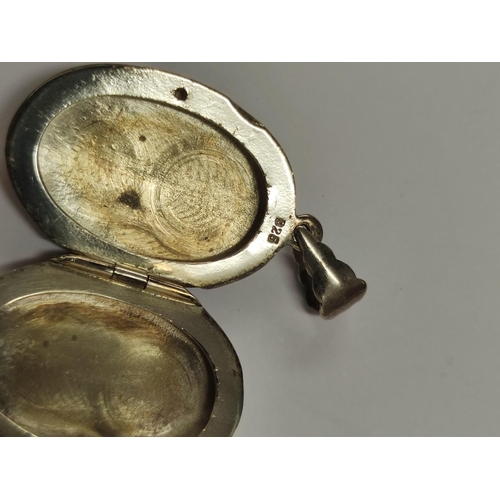 106 - Group of 925 silver to include pendant with a horse profile, moonstone-style pendant, amethyst-colou... 