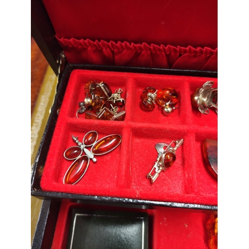 110 - Jewellery box containing miscellaneous costume jewellery to include amber-coloured bracelets, Scotti... 