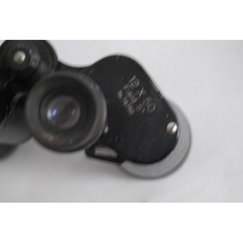 18 - Pair of Zenith 12x50 field binoculars, cased.