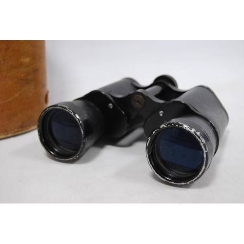 18 - Pair of Zenith 12x50 field binoculars, cased.