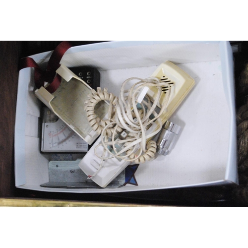 58 - Brass log box containing vintage telephones, accessories and a brass magazine rack, antique water pu... 