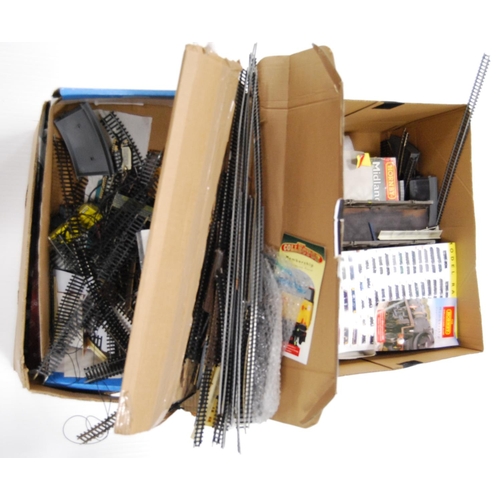 68 - Two cartons containing model railway rolling stock and track to include loose Hornby OO gauge track,... 