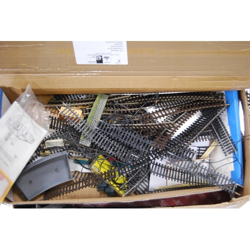 68 - Two cartons containing model railway rolling stock and track to include loose Hornby OO gauge track,... 