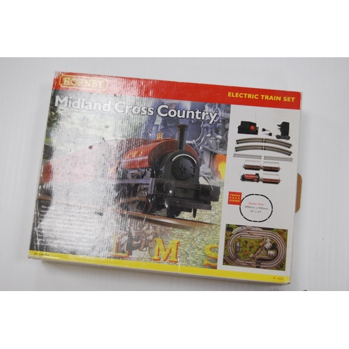 68 - Two cartons containing model railway rolling stock and track to include loose Hornby OO gauge track,... 