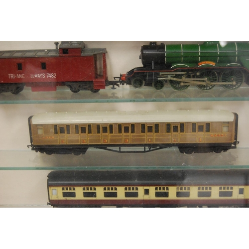 71 - Quantity of OO gauge model railway carriages and engines to include Flying Scotsman and others conta... 