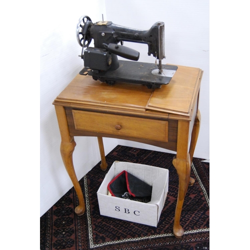 77 - Singer table sewing machine, no. 41671, instruction booklet and some accessories.