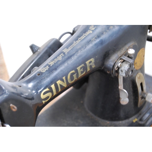 77 - Singer table sewing machine, no. 41671, instruction booklet and some accessories.