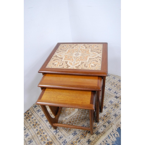 79 - Retro G Plan teak nest of three tables with tiled top.