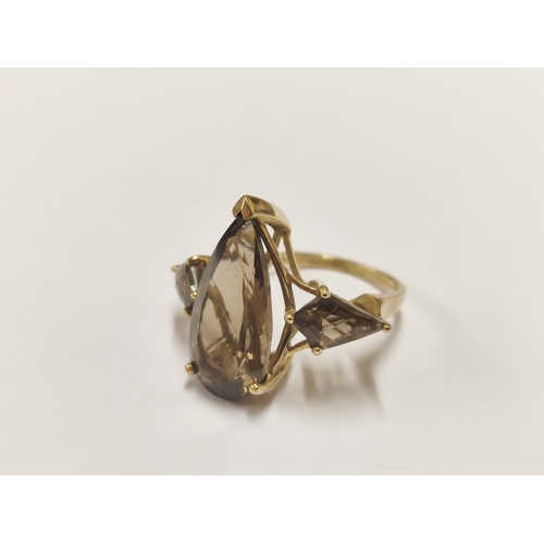 86 - 9ct gold and smoky quartz dress ring, 5g gross.